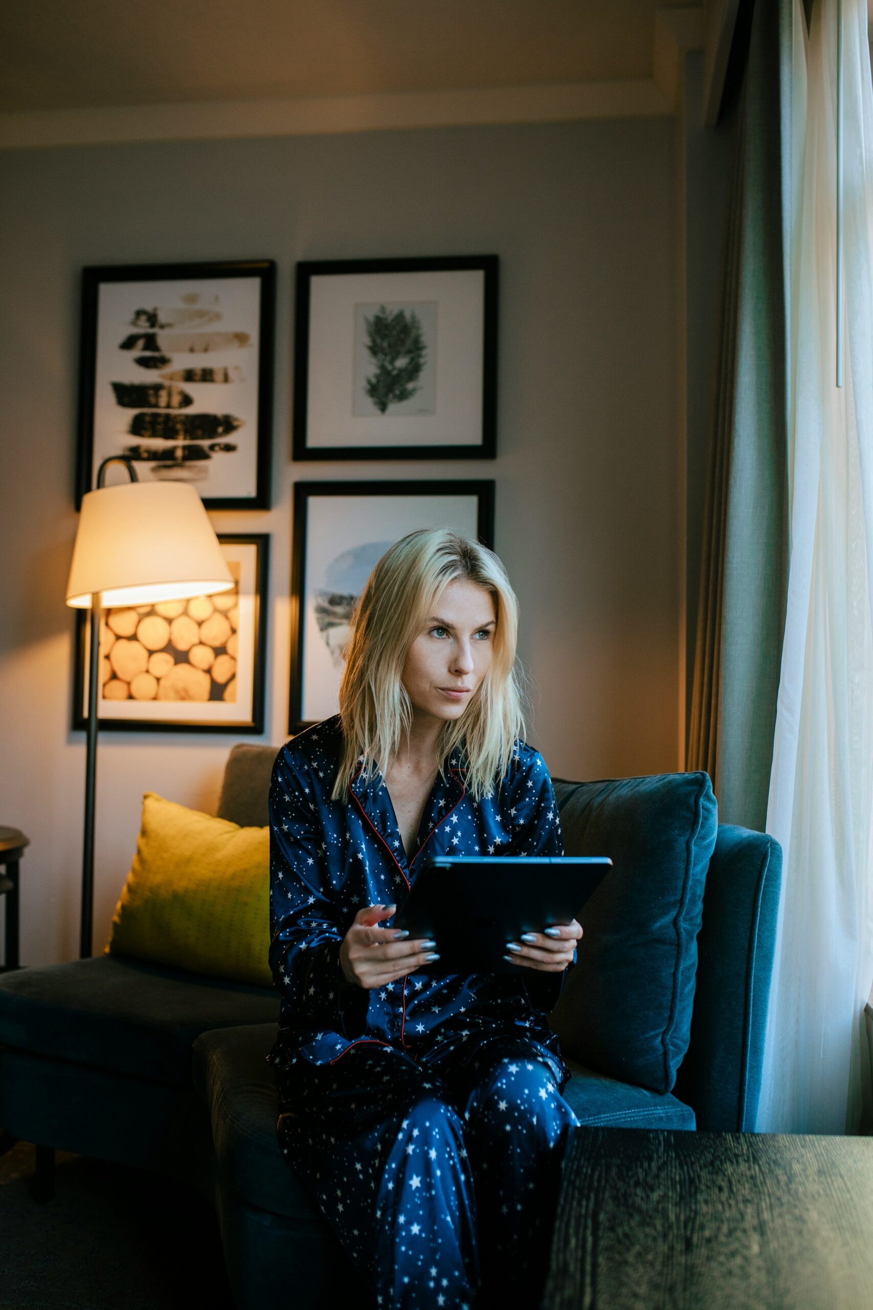 Woman reading a guide on her tablet at home